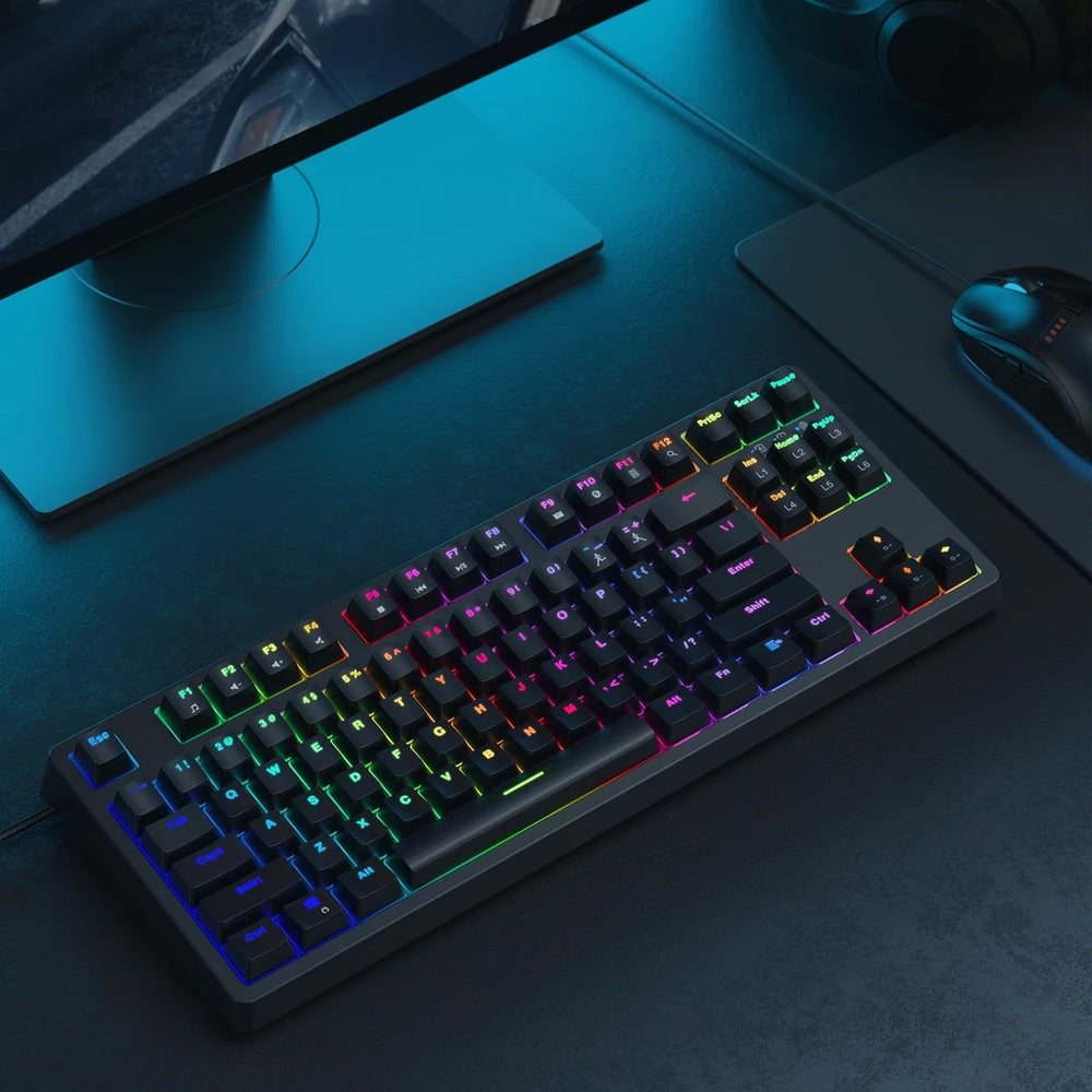 Gadget Aukey Gaming KMG14 mechanical keyboard, compact 87-key design, blue switches, customizable software, ergonomic with RGB backlighting.